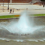 Fountain with spray clouds in the central area