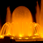 Illuminated fountain with a water sphere