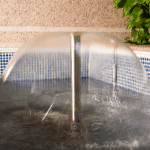 Laminar water effect produced by fountain nozzle mushroom jet