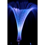 Detail of the cross water jets illuminated at night.