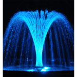 Detail of the cross water jets illuminated at night.