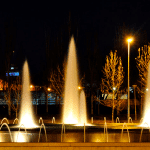 Ornamental fountain illuminated with submersible spotlights