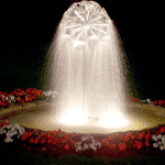 Small sphere of water illuminated by submersible incandescent spotlights